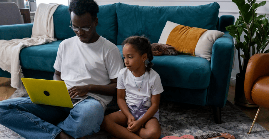 dad trying to work while his daughter watches