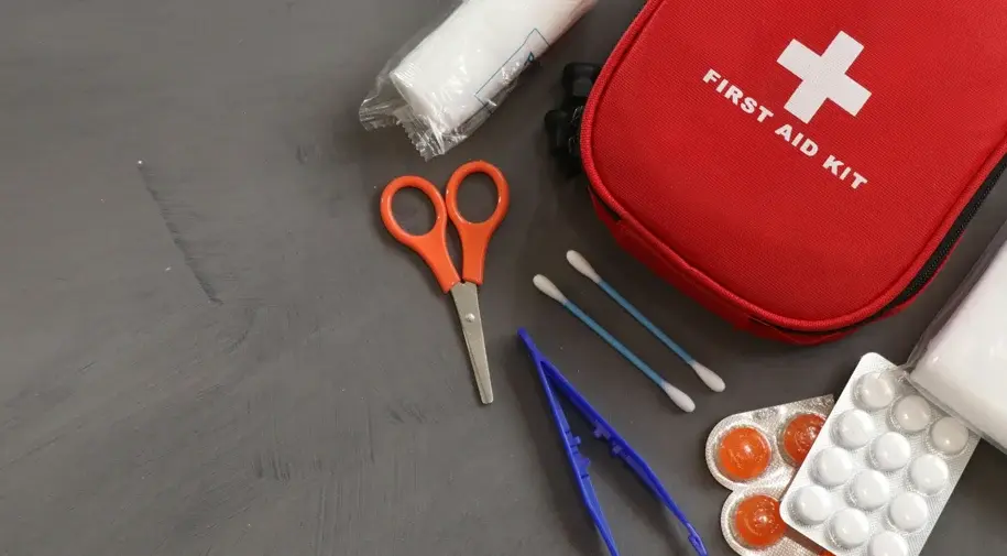 A photo shows a red mini first aid bag and a First Aid Kit.