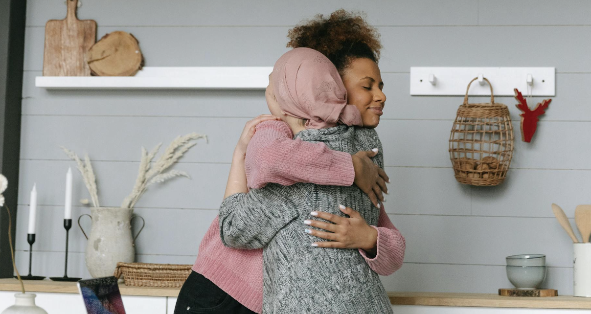 Two women friends hugging