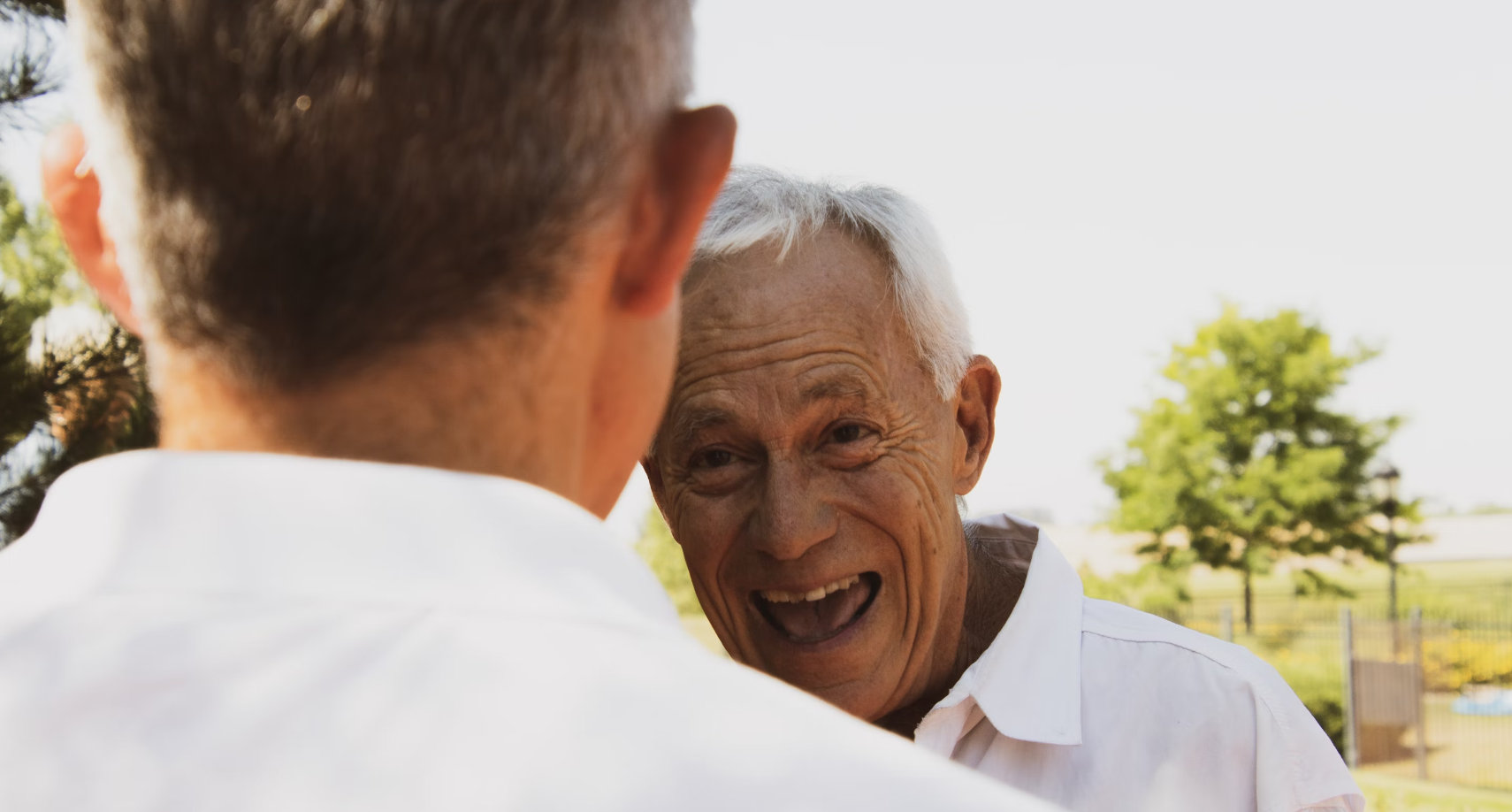 older man excited to see his son