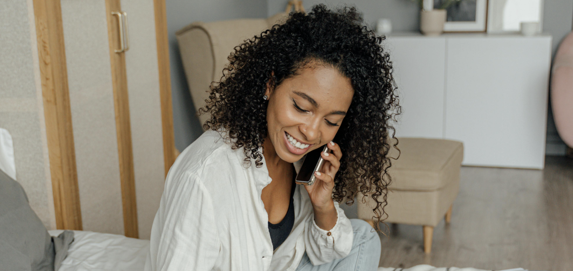 Woman smiling while on a phone call