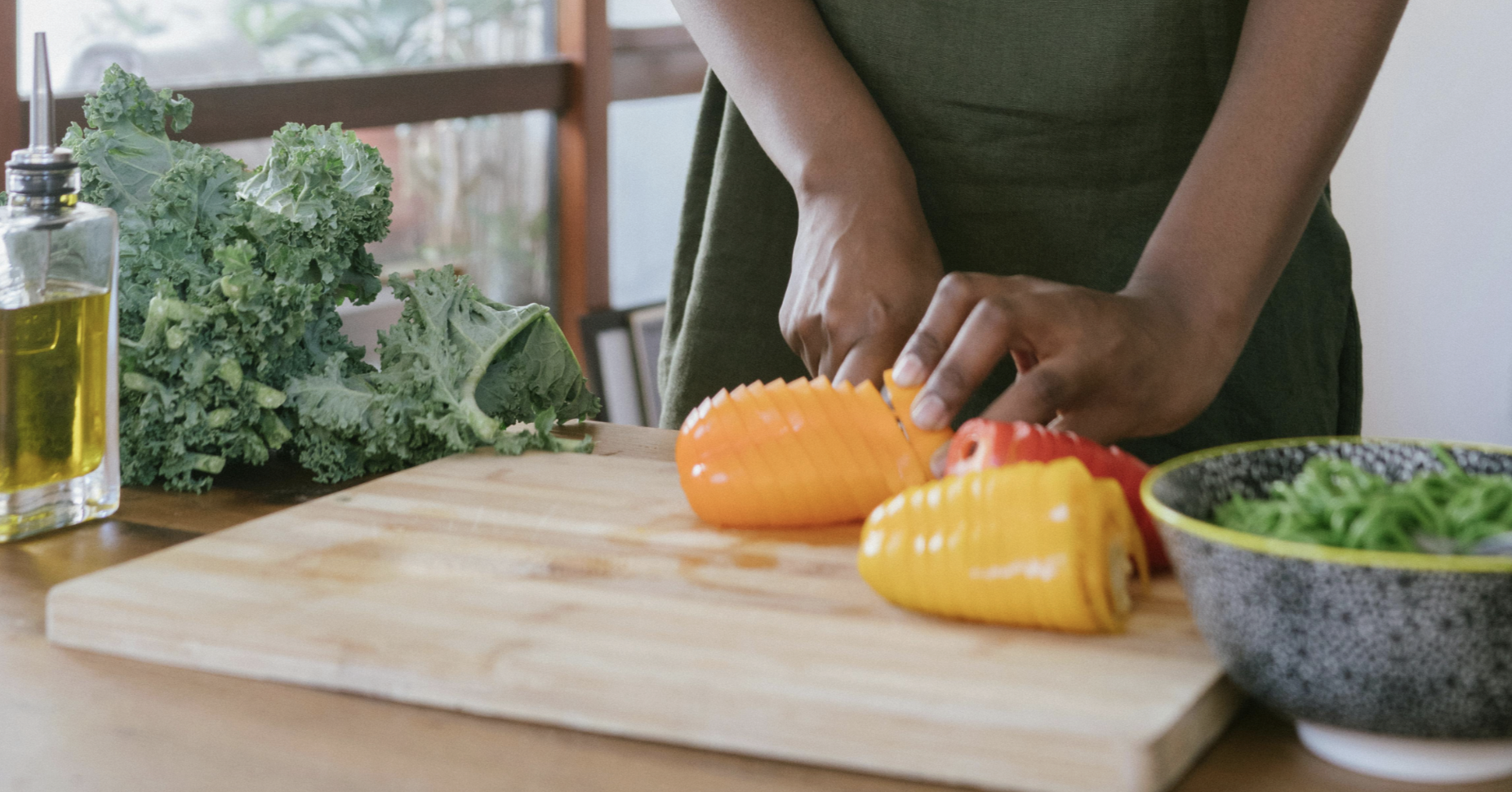 woman chopping bell peppers