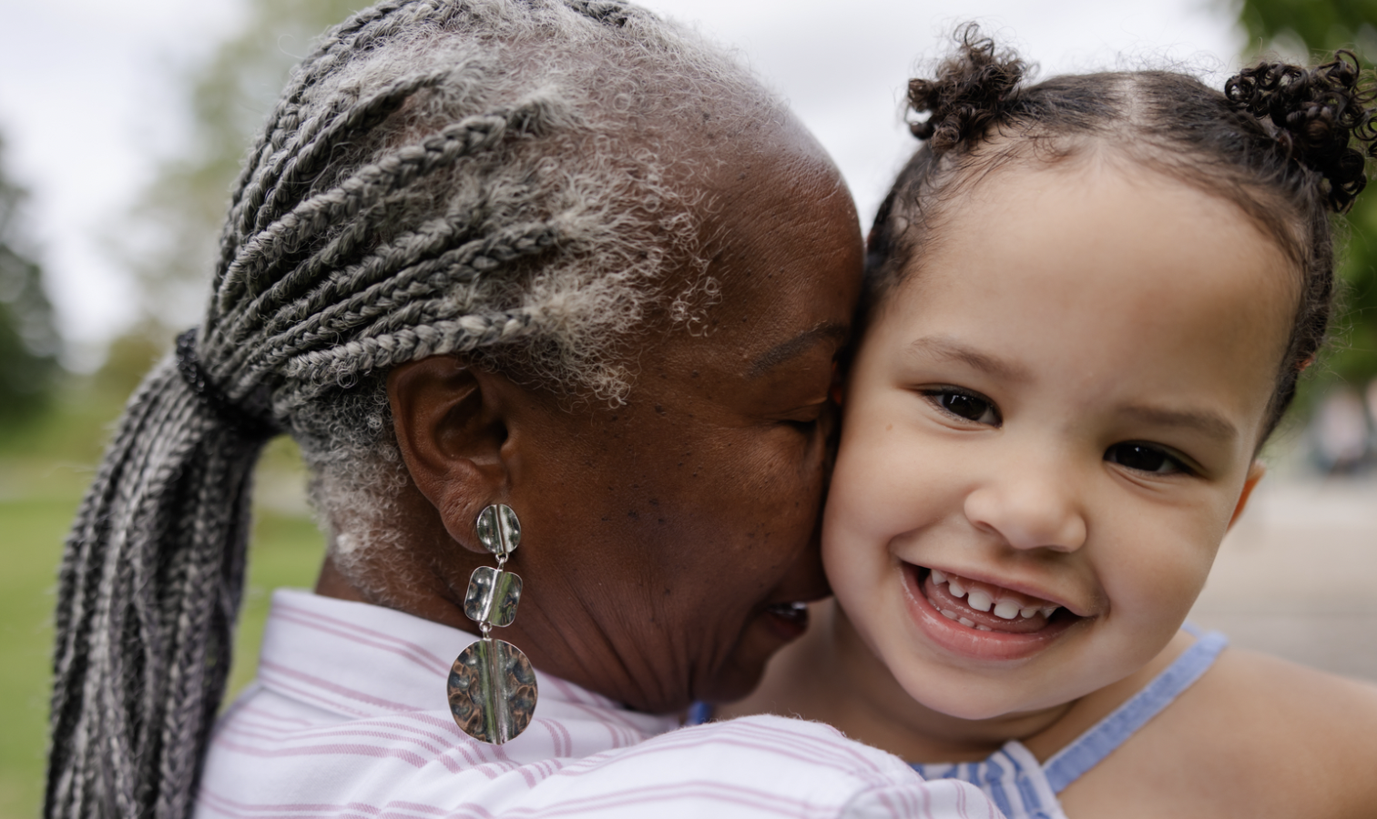 a grandmother hugginer her grandchild